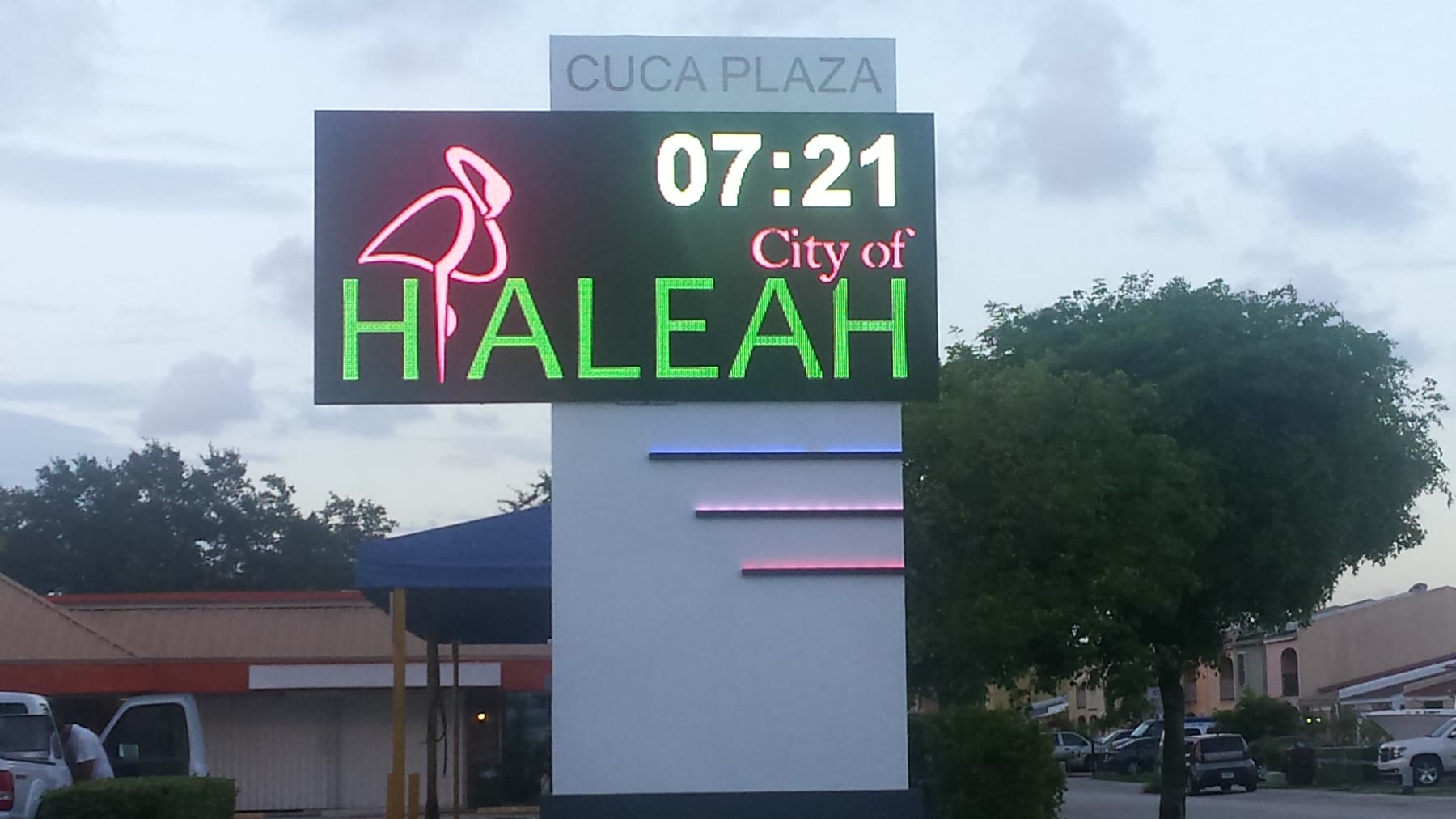 Outdoor LED pylon display showing time and temperature for the City of Hialeah