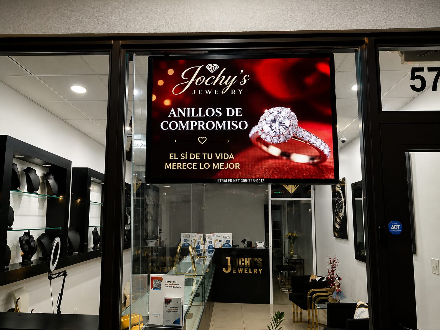 Window LED display at Jochy's Jewelry advertising engagement rings