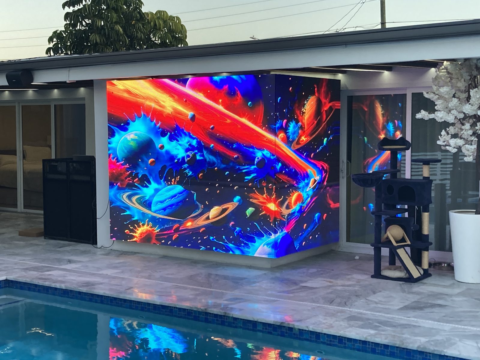 Custom LED display installed on a poolside patio wall